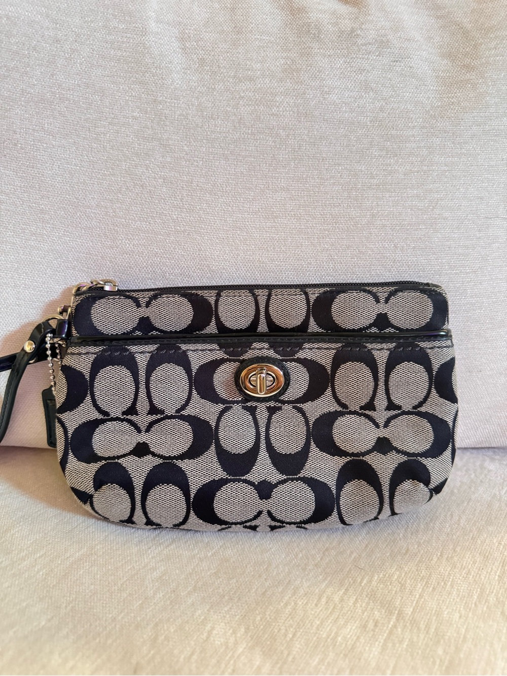 Coach Black and Cream Signature Turnlock Wristlet